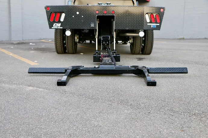 Dynamic Stealth wheel lift extended beneath the rear of a dual-wheel truck with a hauler body